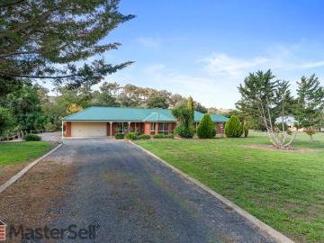 A Captivating Creek side Lifestyle on 1.9 Acres Just Minutes from Town