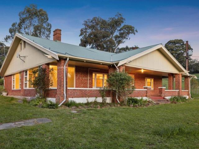 A Character Hills Home on Acreage with Renovation Potential