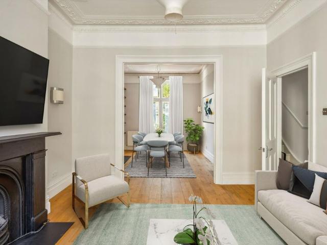 A charming four bedroom home offering generous entertaining space and a delightful rooftop retreat in a prime SW10 setting