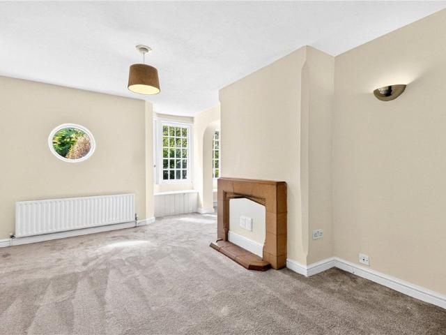A charming four bedroom semi detached cottage with a detached garage and driveway parking in Burton Green
