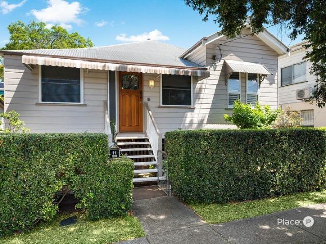 A Charming Highgate Hill Home with Endless Potential, a Stunning Backyard and an Exceptional Address