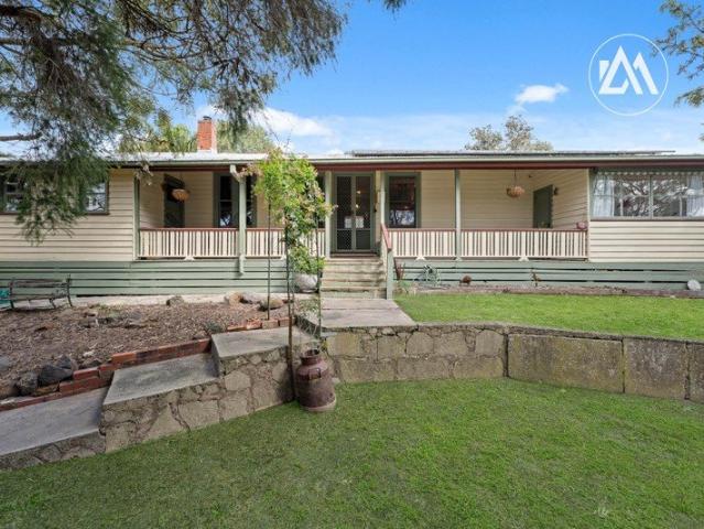 A Charming Home with Character and Endless Potential!