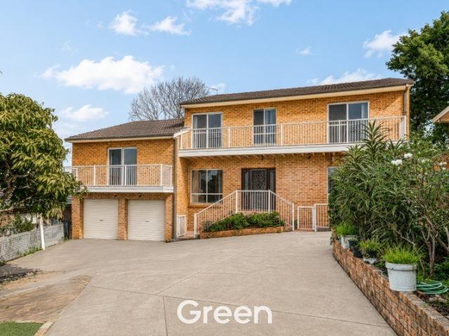 A Cherished Full Brick Family Home with Endless Potential