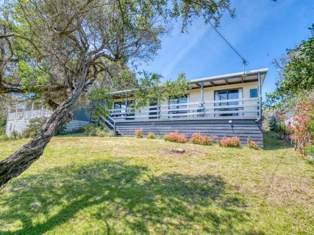 Affordable Coastal Opportunity with Plenty of Potential