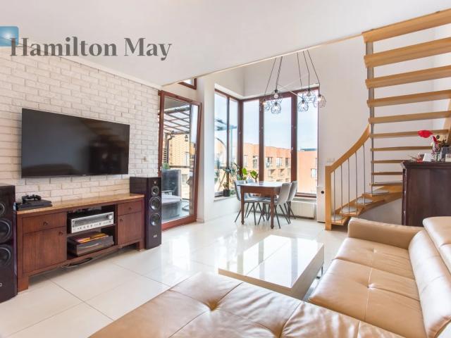 A duplex apartment with 3 bedrooms with a large terrace located in the Corte Verona housing estate in Grabiszyn