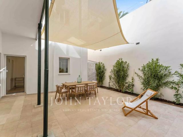 A estrenar Elegante apartamento reformado en planta baja con terraza y piscina en Santa Catalina