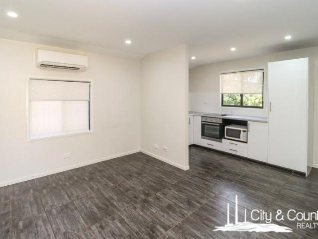 A Fully Renovated, HighYield Investment Opportunity Four Units on One Title