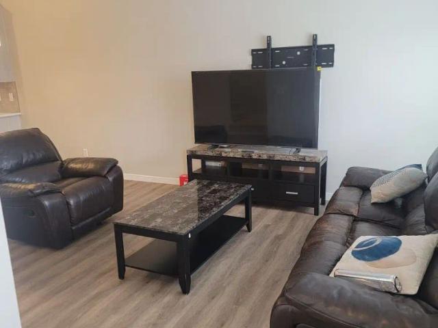 A Furnished 4 bedroom with 3 bathrooms Mainfloor — 4 Bedrooms Main Floor