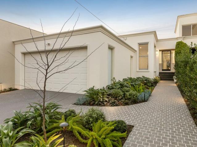 A flawless single level renovation steps from the cafes