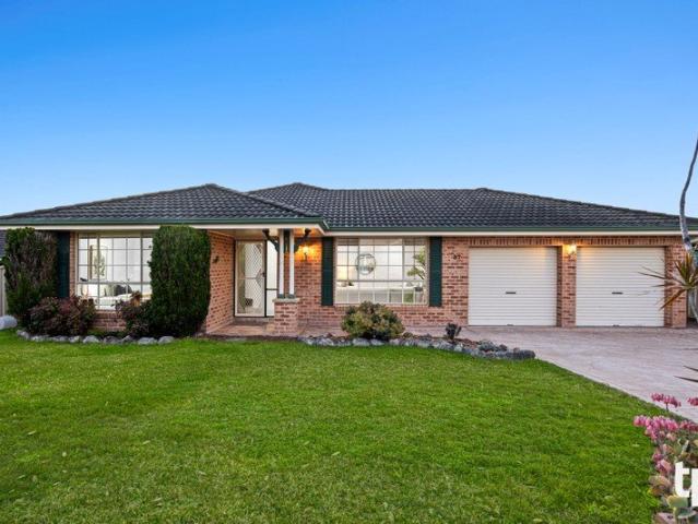 A Fresh New Look, Generous Yard, and Secure Parking for Four