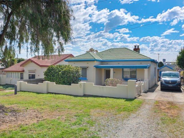 A generous allotment with plenty of charm & potential.