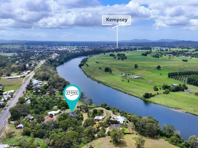 A Grand Riverside Retreat in a Hidden Greenhill Enclave