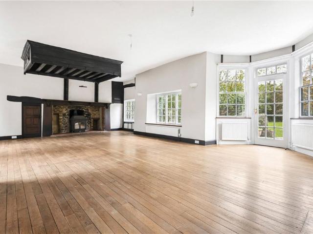 A Grade ll listed detached family home over three floors, with two double garages and driveway parking in Ickenham
