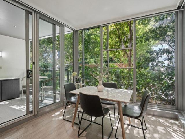 A green retreat framed by glass