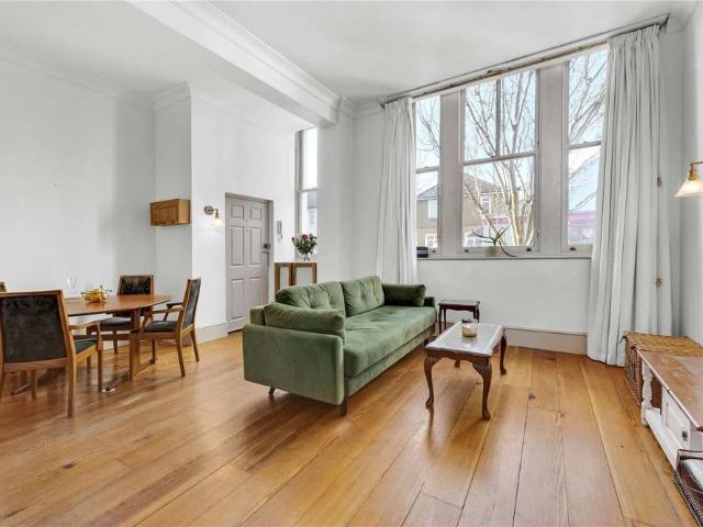 A ground floor two bedroom apartment on Bridge Road with a private patio garden and access to communal gardens directly overlooking the River Thames