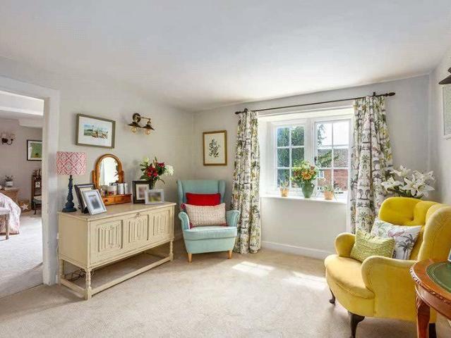A handsome detached Grade II Listed family home in the pretty village of Keevil, some 15 miles east of Bath with 5 bedroooms, 3 bathrooms and 3 reception rooms and 0.88 acres of garden