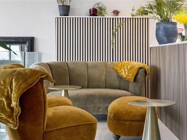 A highly individual, architecturally designed contemporary home set within beautifully landscaped gardens on the Thames riverfront