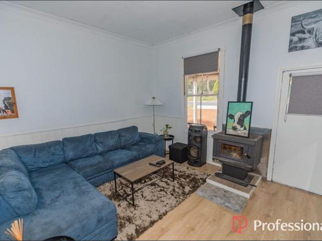 A home of cottage charm with an enormous shed this property is not to be missed!