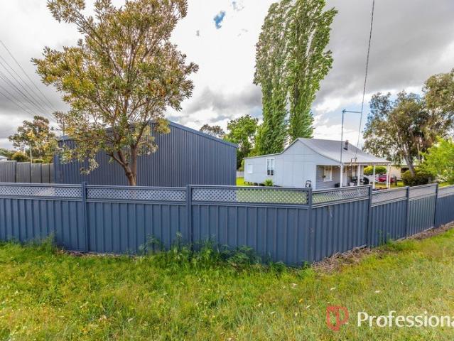A home of cottage charm with an enormous shed this property is not to be missed!