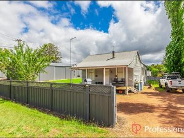 A home of cottage charm with an enormous shed this property is not to be missed!