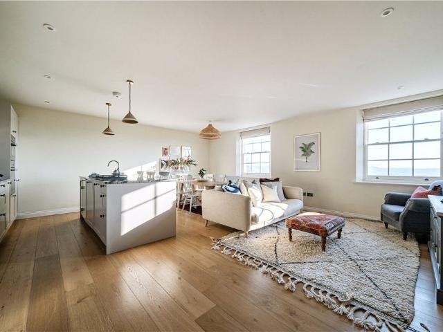 A luxurious and immaculate two bedroom, two bathroom apartment in an elevated position on the lower Lansdown slopes with allocated off street parking space