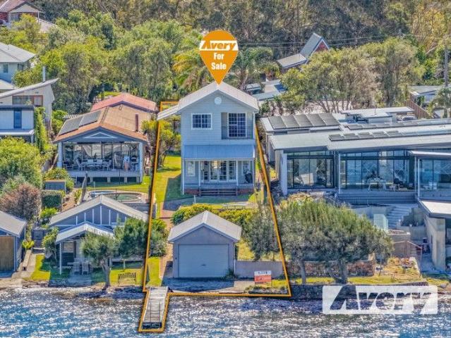 A Lakeside Opportunity on One of Coal Point's Most Coveted Streets