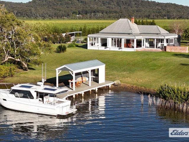 A Landmark Riverfront Estate with Luxury at Every Turn