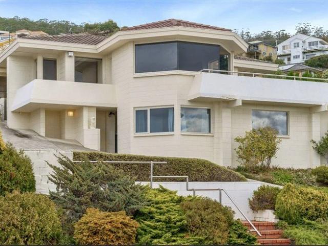 A large holiday house with stunning water mountain views