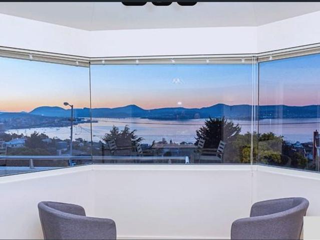 A large holiday house with stunning water mountain views