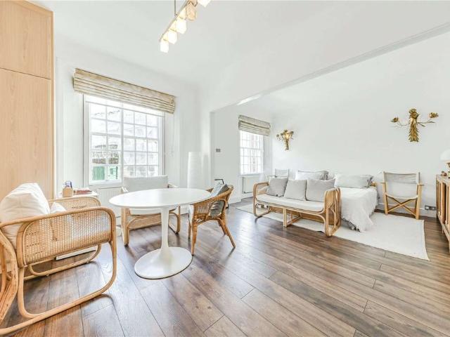 A lateral four bedroom apartment on St. John's Wood High Street is available for rent