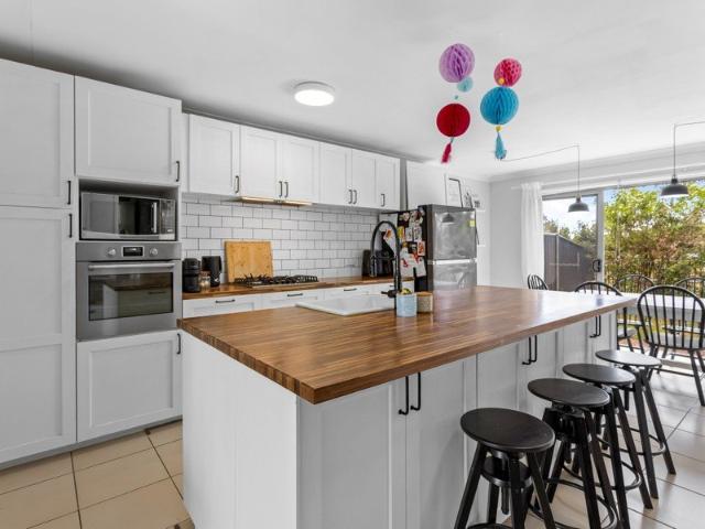A Leafy Retreat with a Stylish Kitchen & Entertainer's Courtyard