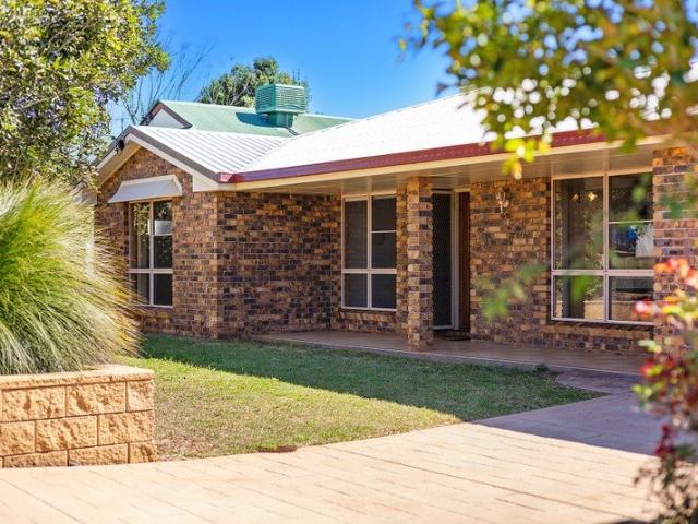 A lowset, brick family home with northern rear garden vehicle access to 6m x 6m shed
