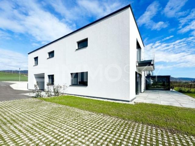 À louer à Courtételle  Élégante villa neuve avec jardin
