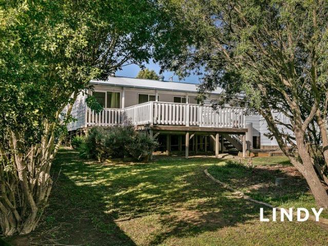 A Lovely Home with an Incredible Deck & Dream Shed!