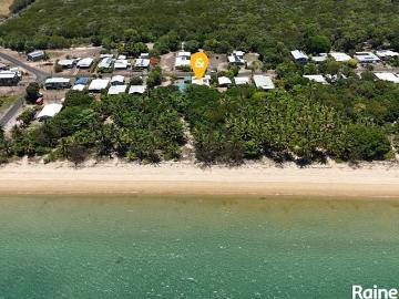 A palm fringed, unspoilt tropical beach at the back gate
