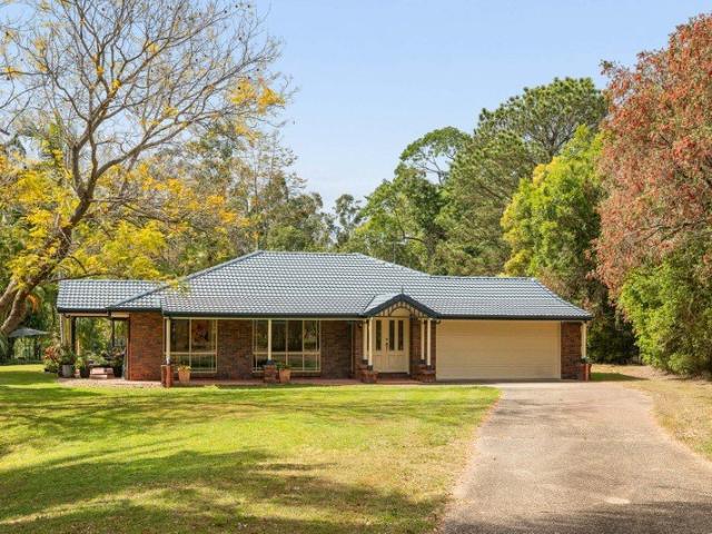 A peaceful acreage retreat with trails at your doorstep