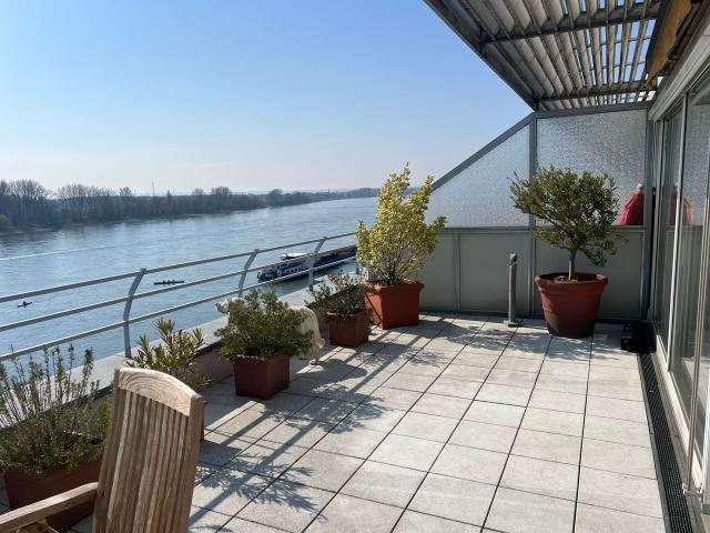 A penthouse feel across 104 m² with a 35 m² south facing roof terrace and views of the Rhine, Koln Amsterdam Apartments for Rent
