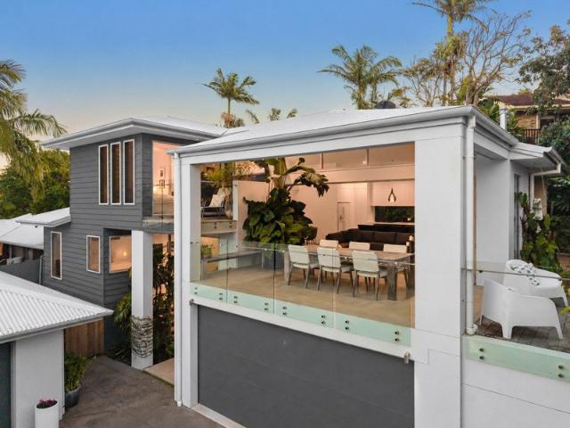A Perfectly Designed Multi level Masterpiece with Lush Tropical Surrounds