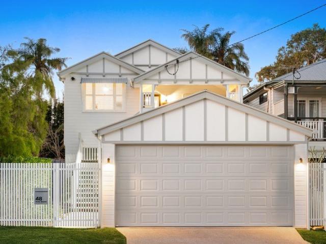A picture perfect Queenslander inspired retreat + poolside family bliss in a leafy inner east enclave