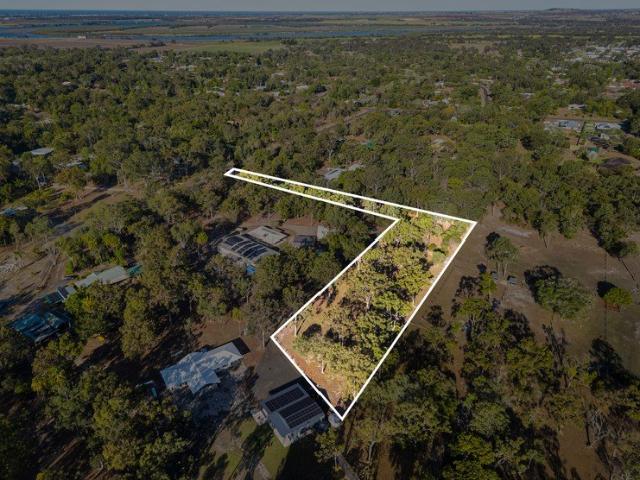 A Private Acreage Retreat with Space to Build Your Dream