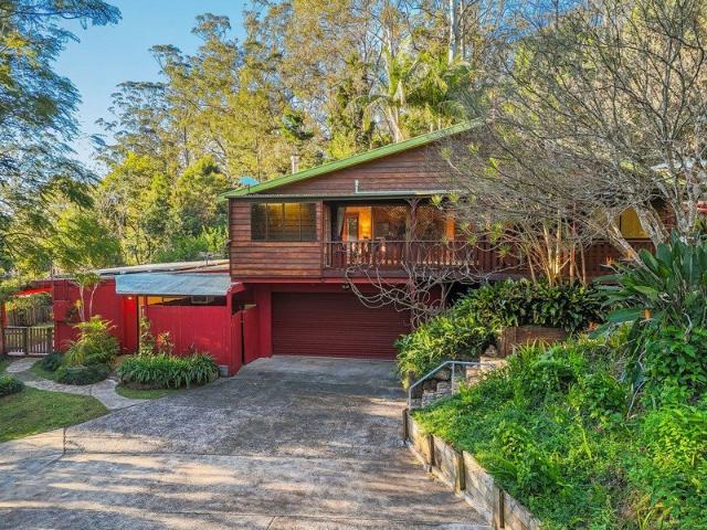 A Private Acreage Sanctuary with Dual Living Potential
