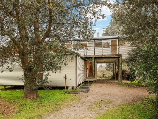 A Private Architectural Retreat with Uninterrupted Rhyll Inlet Views