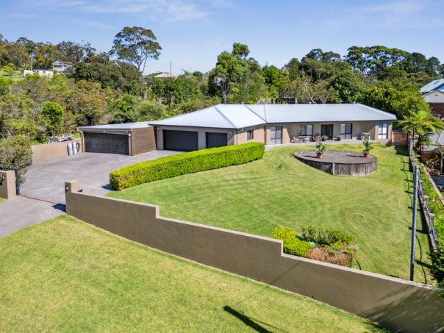A private executive style sanctuary sprawling single level living with expansive grounds and ultimate garaging