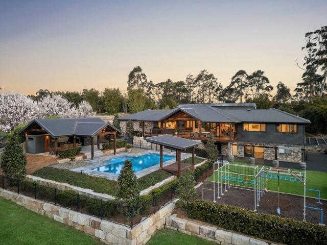 A private family estate set on 2.5 prime acres, moments to the beach