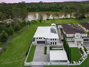 A Private Riverfront Estate of Scale, Exceptional Family Living, Luxury and Architectural Presence