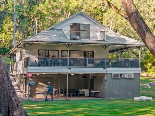A Private Riverside Retreat Designed for Living, Entertaining & Escape