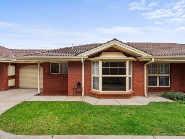 A quality built homette with space, privacy and convenience in a tightly held group of just three