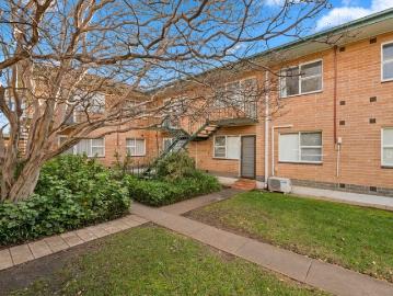A Quiet Upper Level Unit with a Car Optional Lifestyle
