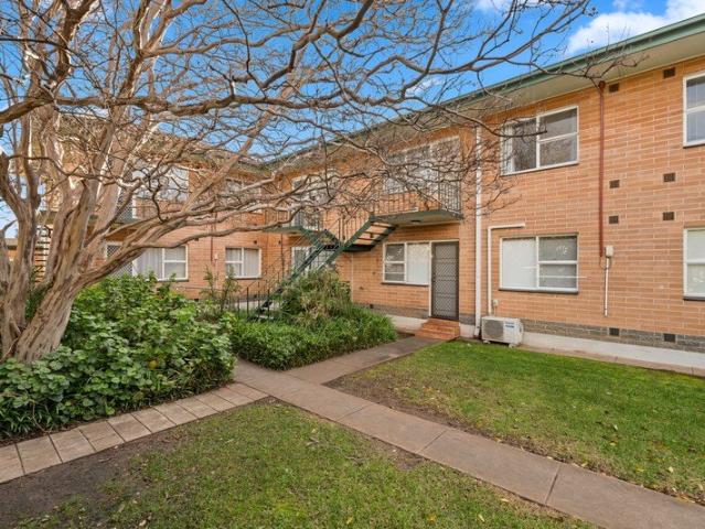 A Quiet Upper Level Unit with a Car Optional Lifestyle
