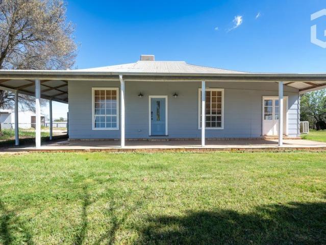 A Rural Cottage on Acreage Freshly Renovated & Full of Potential!